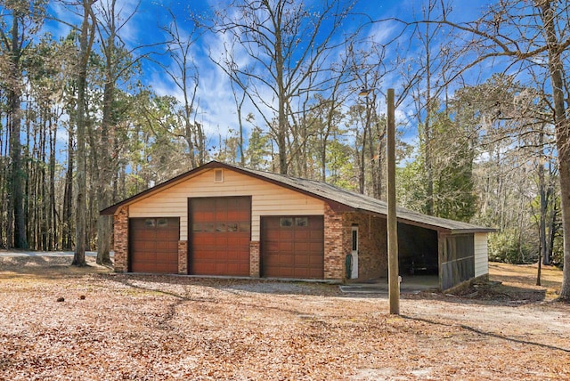 garage featuring a carport