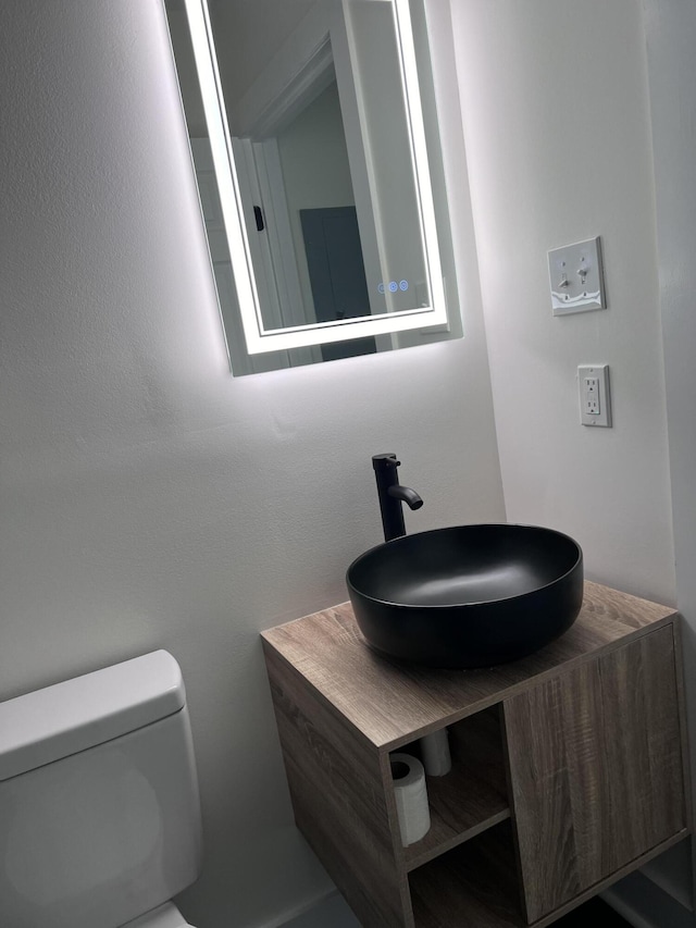 bathroom with toilet and a sink
