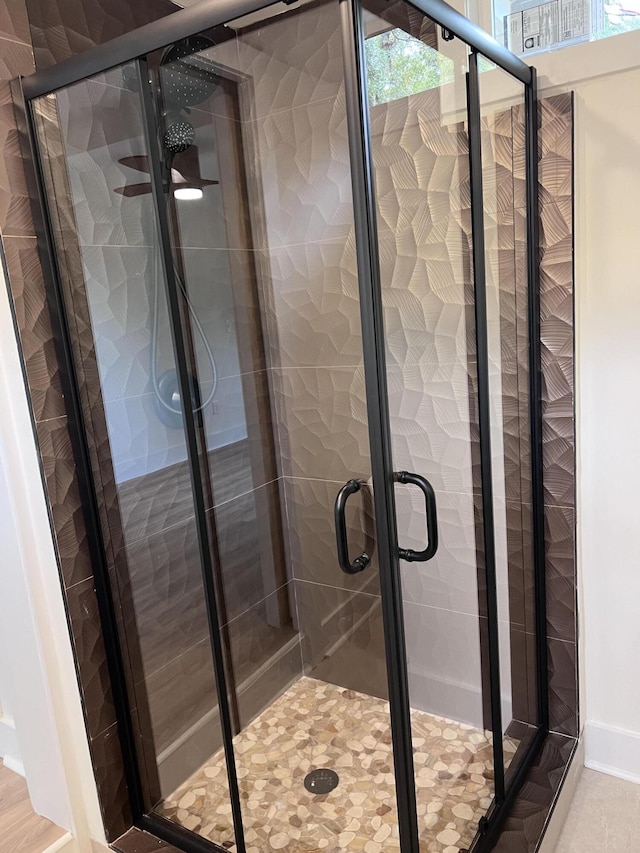 full bathroom featuring a shower stall
