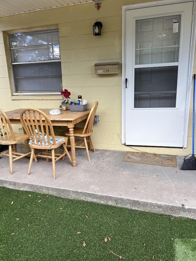 property entrance with a patio