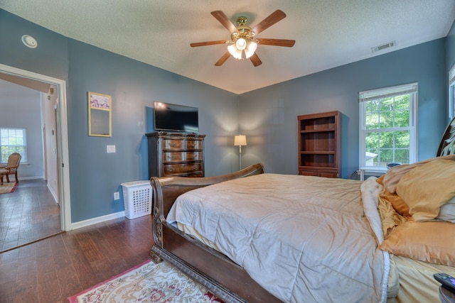 106 Trimley Ct, Goose Creek, SC 29445 - bedroom with multiple windows, wood finished floors, baseboards, a textured ceiling, and ceiling fan