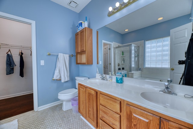 106 Trimley Ct, Goose Creek, SC 29445 - full bath with a shower stall, a garden tub, double vanity, baseboards, and a walk in closet