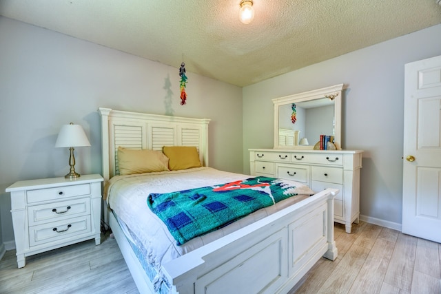 106 Trimley Ct, Goose Creek, SC 29445 - bedroom with light wood-style floors and a textured ceiling