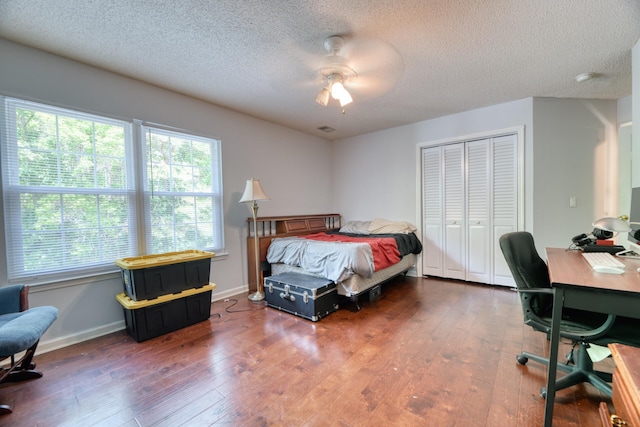 106 Trimley Ct, Goose Creek, SC 29445 - bedroom with a textured ceiling, hardwood / wood-style floors, a closet, a desk, and baseboards