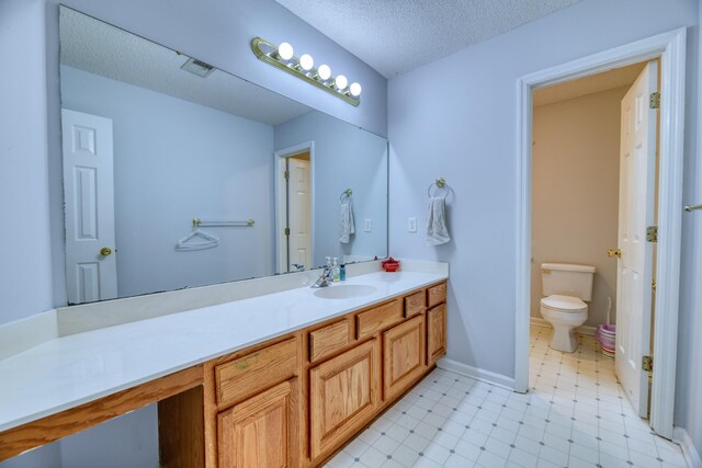 106 Trimley Ct, Goose Creek, SC 29445 - bathroom with toilet, vanity, a textured ceiling, and tile patterned floors
