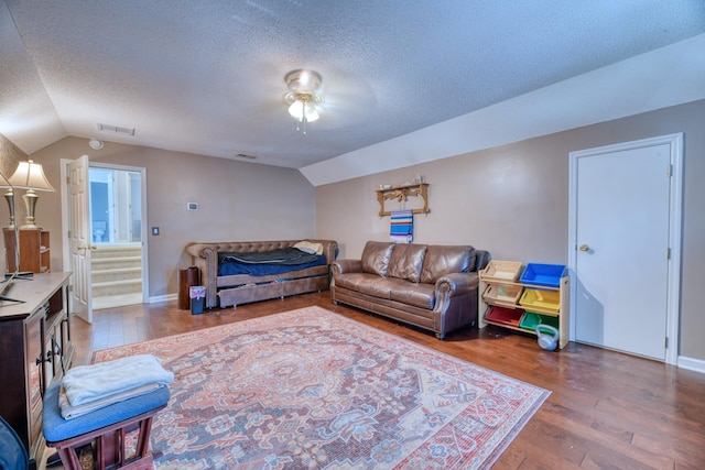 106 Trimley Ct, Goose Creek, SC 29445 - living room with lofted ceiling, wood finished floors, a textured ceiling, ceiling fan, and baseboards