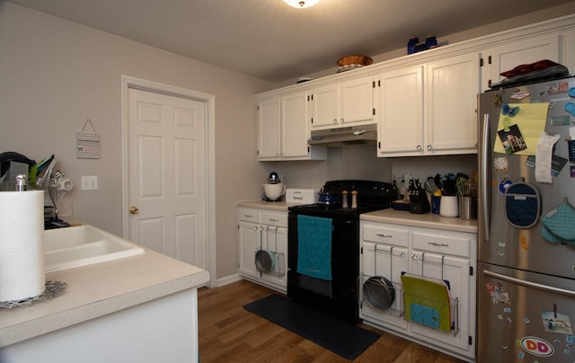 kitchen featuring stainless steel refrigerator, sink, white cabinets, black electric range oven, and dark hardwood / wood-style flooring