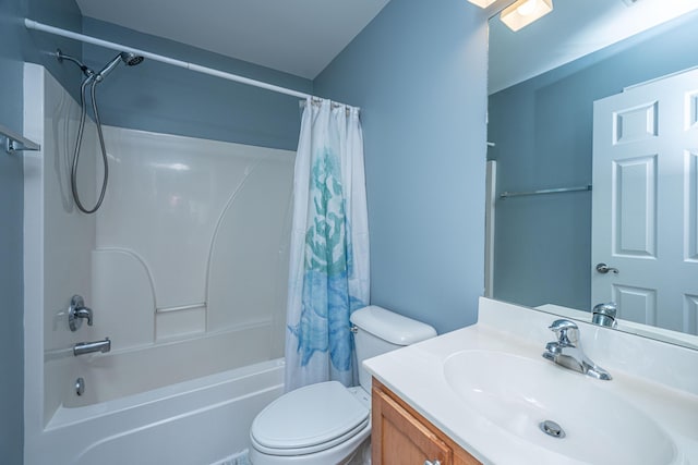 full bathroom featuring shower / bath combination with curtain, vanity, and toilet