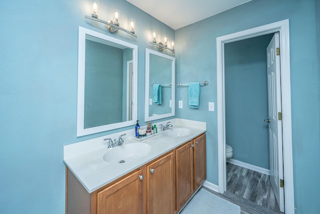 bathroom with vanity and toilet