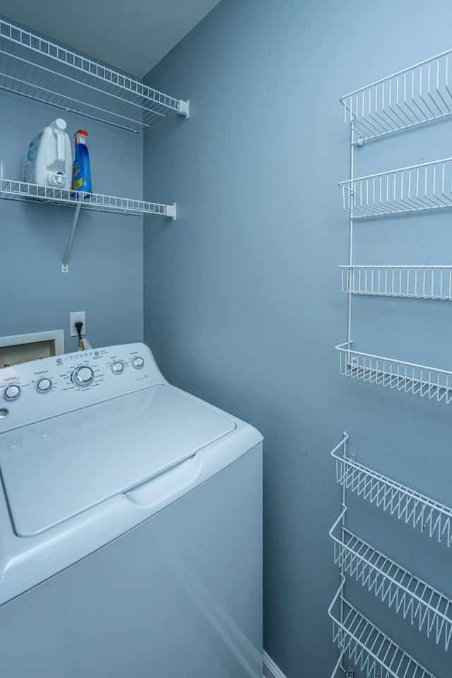 washroom with washer / dryer