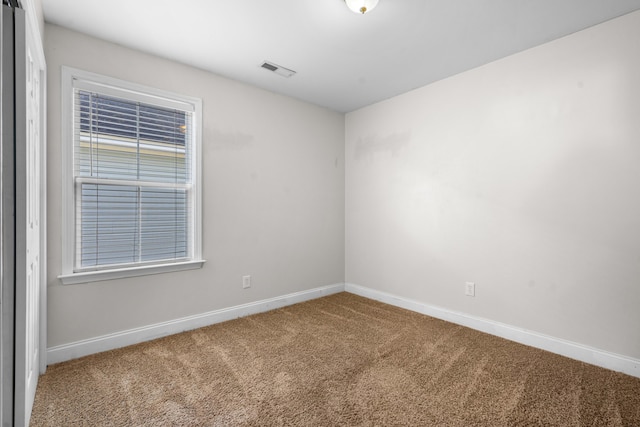 spare room featuring carpet flooring