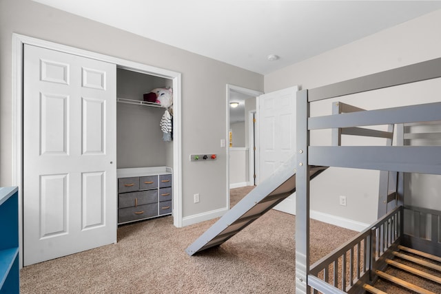 bedroom with carpet flooring and a closet