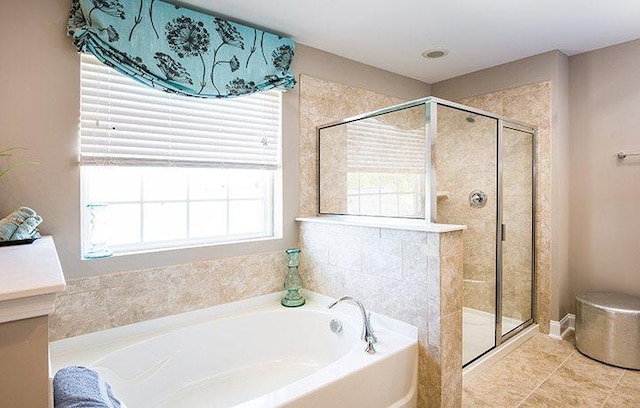 bathroom featuring shower with separate bathtub and tile patterned floors