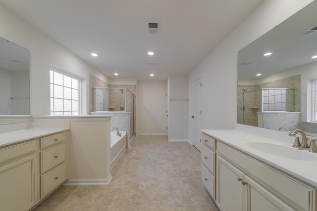 bathroom featuring vanity, tile patterned floors, and separate shower and tub