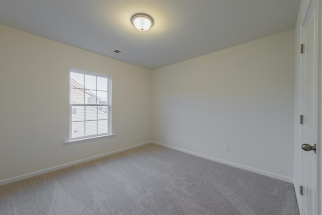 unfurnished room featuring carpet flooring