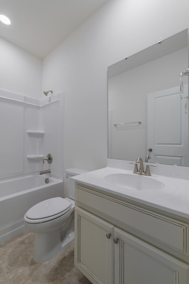 full bathroom featuring tile patterned floors,  shower combination, toilet, and vanity