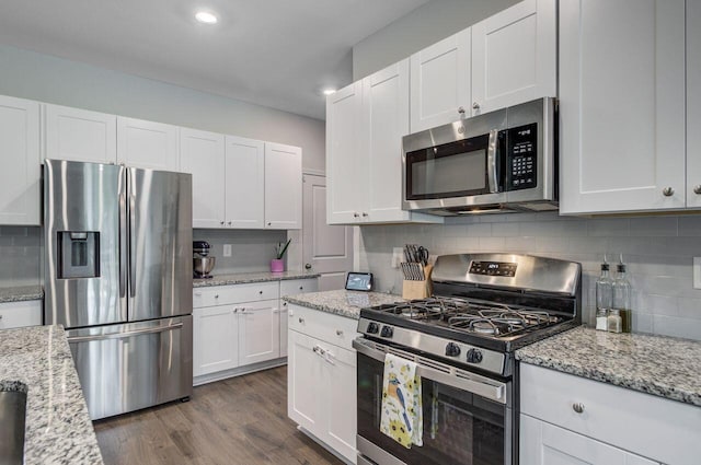 493 Spanish Wells Rd, Summerville, SC 29486 - kitchen featuring appliances with stainless steel finishes, white cabinetry, tasteful backsplash, dark wood-style floors, and recessed lighting