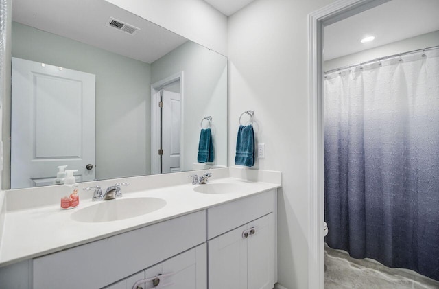 493 Spanish Wells Rd, Summerville, SC 29486 - full bathroom featuring double vanity and toilet
