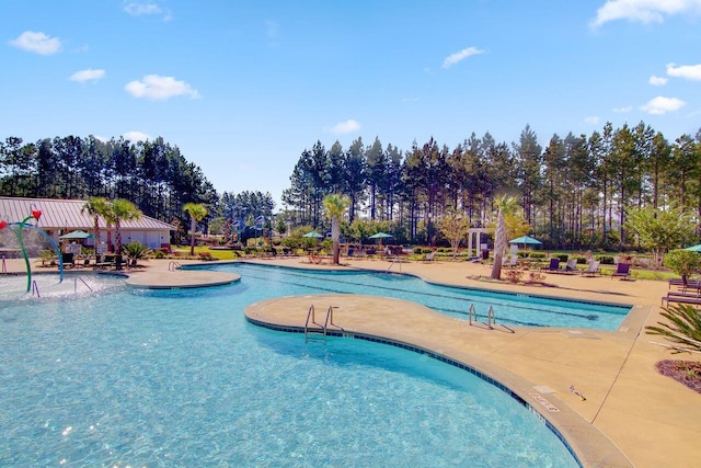 493 Spanish Wells Rd, Summerville, SC 29486 - community pool with a patio and view of wooded area