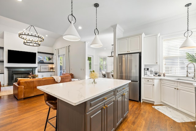 4009 E Amy Ln, Johns Island, SC 29455 - kitchen with freestanding refrigerator, a sink, white cabinetry, dark wood-style floors, and a kitchen island