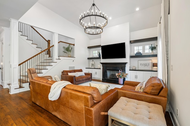 4009 E Amy Ln, Johns Island, SC 29455 - living area with stairs, dark wood-style flooring, a fireplace, vaulted ceiling, and healthy amount of natural light