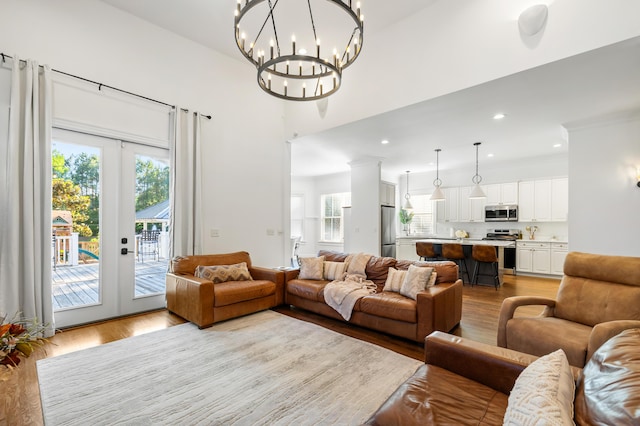 4009 E Amy Ln, Johns Island, SC 29455 - living room featuring light wood finished floors, french doors, healthy amount of natural light, and recessed lighting