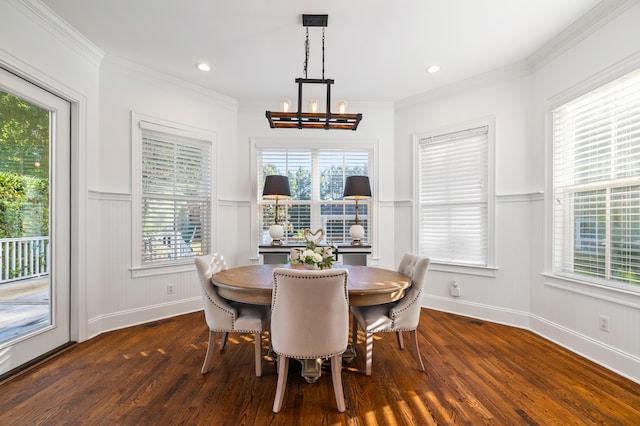 4009 E Amy Ln, Johns Island, SC 29455 - dining area with dark wood finished floors, a chandelier, wainscoting, ornamental molding, and a decorative wall