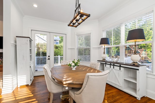 4009 E Amy Ln, Johns Island, SC 29455 - dining space featuring plenty of natural light, french doors, ornamental molding, dark wood-style flooring, and wainscoting