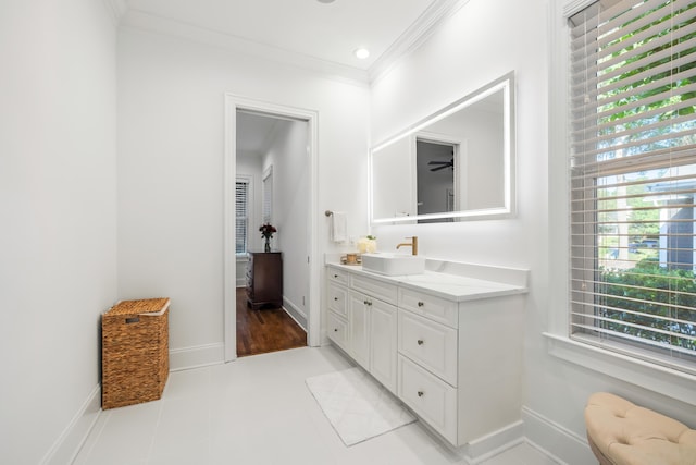 4009 E Amy Ln, Johns Island, SC 29455 - bathroom featuring ornamental molding, vanity, baseboards, and tile patterned flooring