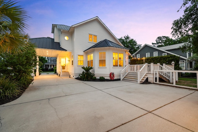 4009 E Amy Ln, Johns Island, SC 29455 - view of front of home with a standing seam roof, metal roof, and concrete driveway