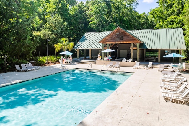 4009 E Amy Ln, Johns Island, SC 29455 - community pool with a patio and view of wooded area