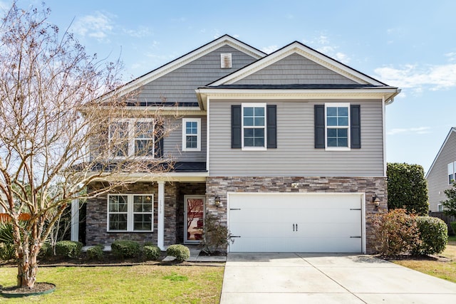 craftsman inspired home with a balcony, driveway, an attached garage, a front lawn, and stone siding