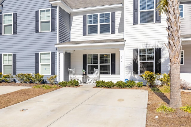 view of property with a porch