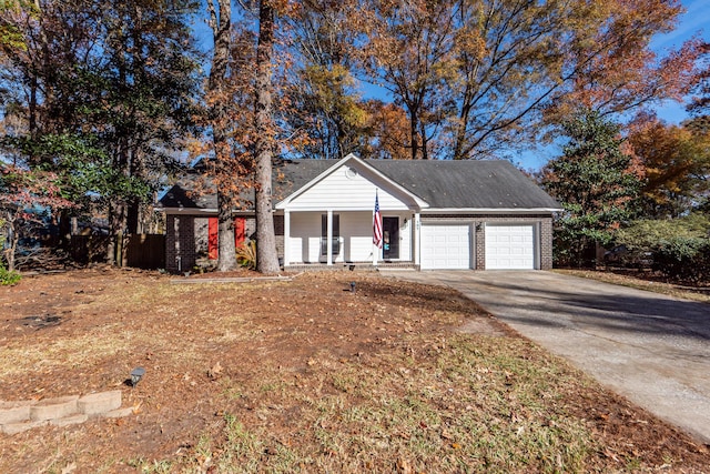 view of front of property featuring a porch and a garage