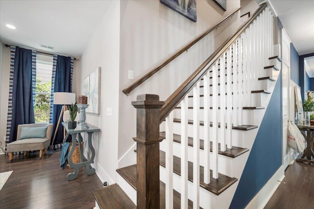 staircase with hardwood / wood-style flooring