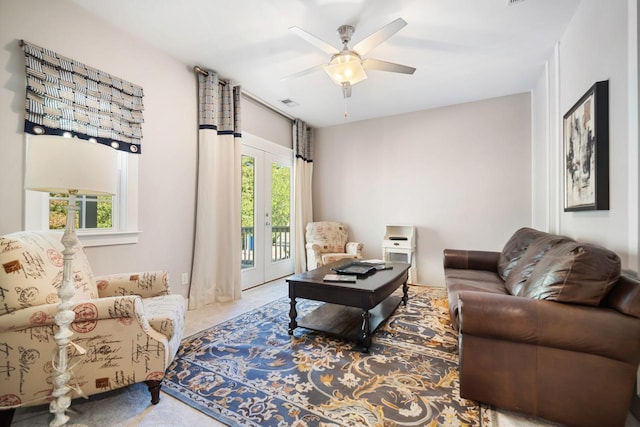 living room with ceiling fan and french doors