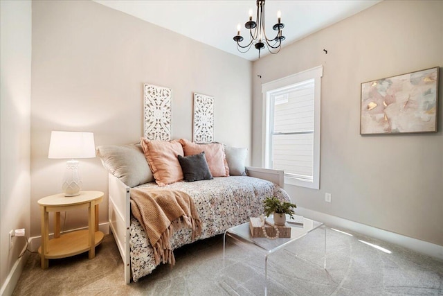 bedroom with a chandelier and carpet flooring