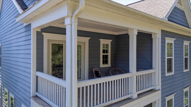 view of property exterior with covered porch