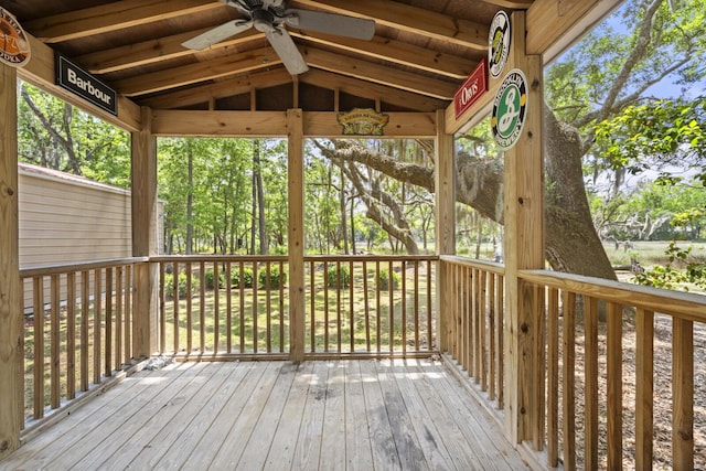 wooden deck with a ceiling fan