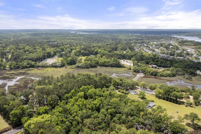 birds eye view of property with a wooded view