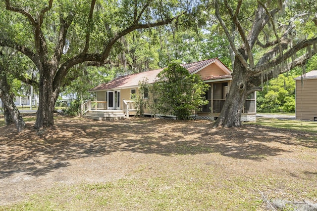 ranch-style home with metal roof