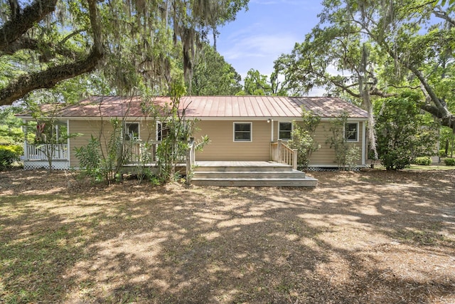 back of property with metal roof