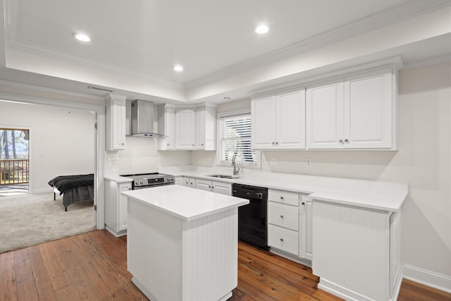 kitchen featuring stainless steel electric range oven, a raised ceiling, a sink, wall chimney range hood, and dishwasher