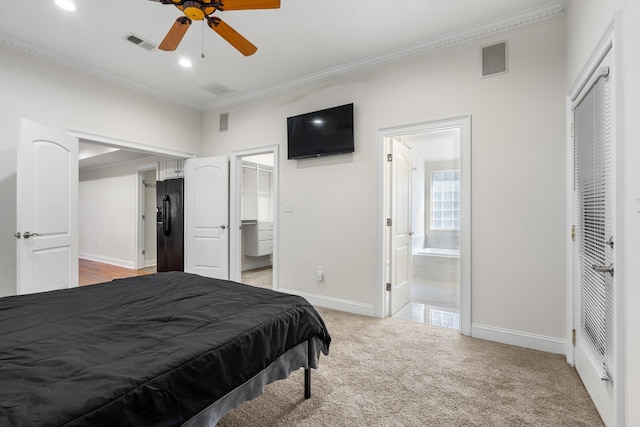 bedroom featuring visible vents, black refrigerator with ice dispenser, crown molding, and light colored carpet