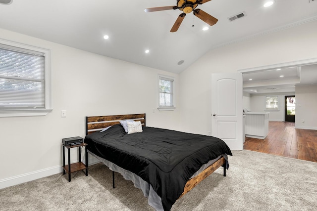 bedroom with recessed lighting, visible vents, baseboards, and multiple windows