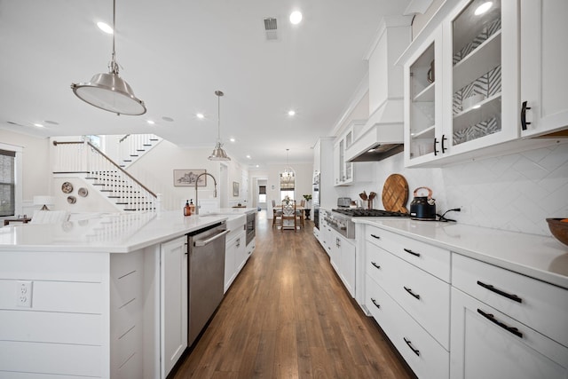 kitchen with tasteful backsplash, dishwasher, ornamental molding, white cabinetry, and dark wood-style flooring