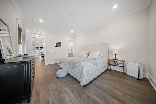 bedroom with dark wood-style floors, recessed lighting, baseboards, and ornamental molding