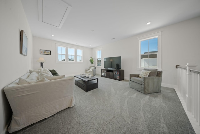 living area with recessed lighting, baseboards, carpet floors, and attic access