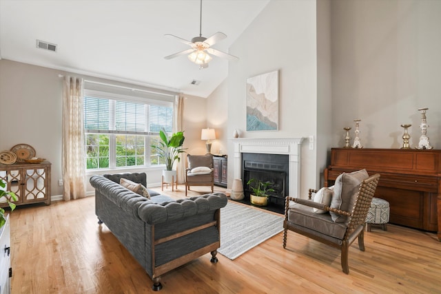 3526 Stockton Dr, Mount Pleasant, SC 29466 - living area with a ceiling fan, a fireplace with flush hearth, visible vents, high vaulted ceiling, and wood finished floors