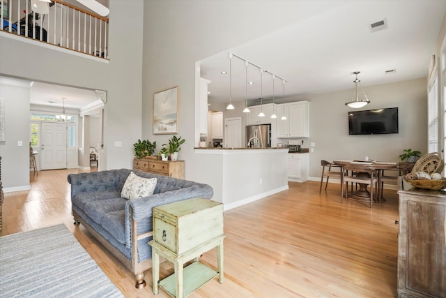 3526 Stockton Dr, Mount Pleasant, SC 29466 - living room with visible vents, baseboards, and light wood-type flooring